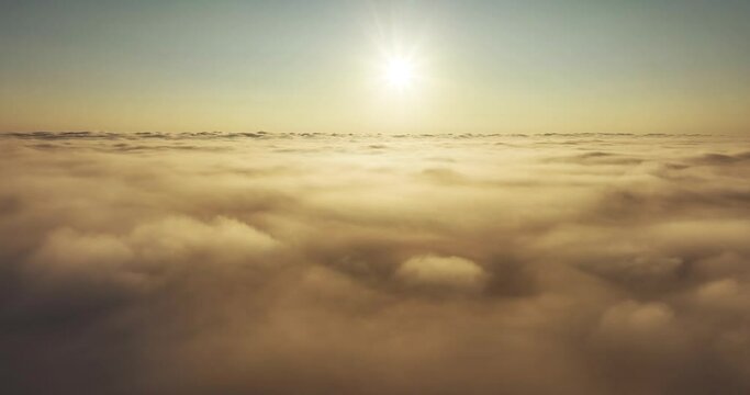 Beautiful sunrise over cloud Drone view camera mover over cloud background 