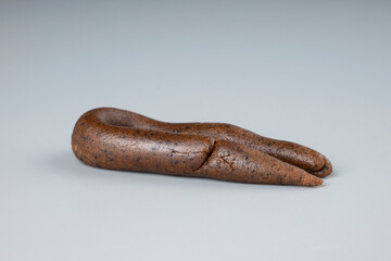 hashish rope for smoke cannabis blunt, high thc weed brown hash on gray background