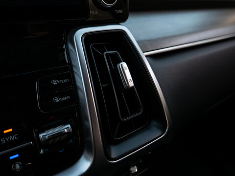 Vehicle air-conditioning system vent close-up photograph taken from the inside of a vehicle