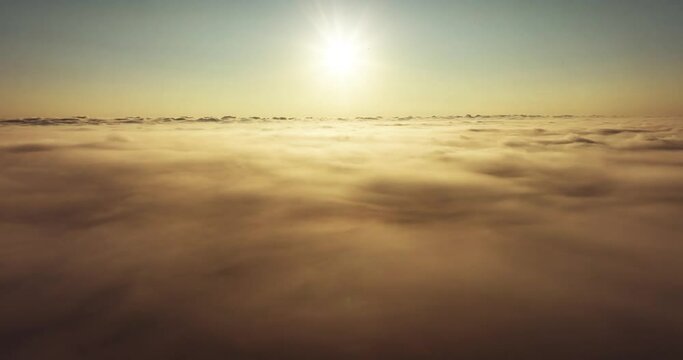 Beautiful sunrise over cloud Drone view camera mover over cloud background 
