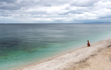 Couple on an isolated beach, Isola d'Eba. 