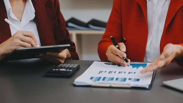 Businessman and team analyzing financial statement Finance task. with smart phone and laptop and tablet. Wealth management concept