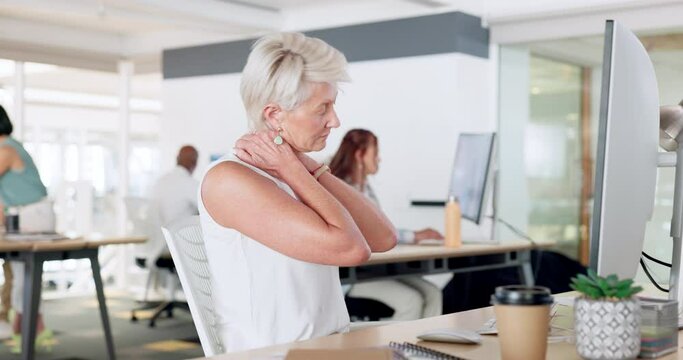 Stress, neck pain and burnout with a business man rubbing her shoulders while working in the office. Computer, cramp and tension with a senior female employee suffering with strain at work