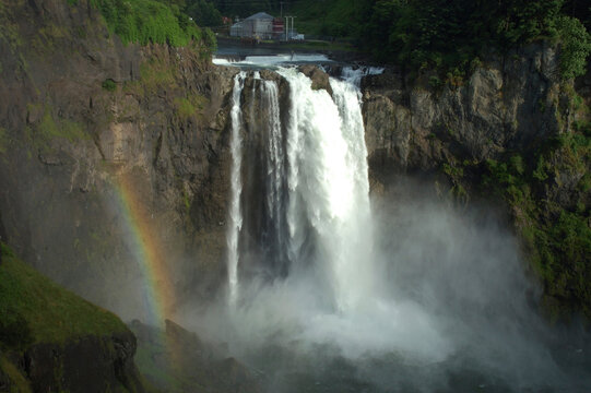 Rainbow at Snoqualmie Falls, WA.  A power plant is visible.; Snoqualmie Falls, Washington