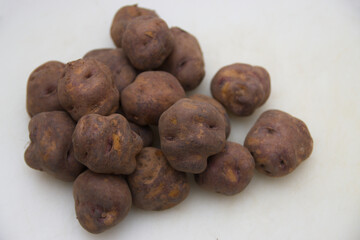 Black potatoes to make papas arrugadas, recipe from the Canary Islands, Spain