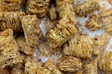 Close view of high fiber wheat cereal with skim milk.