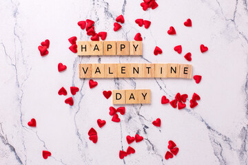Romantic  layout. Wooden latters on  white marble background.  Top view. St. Valentines day postcard. - 554314204