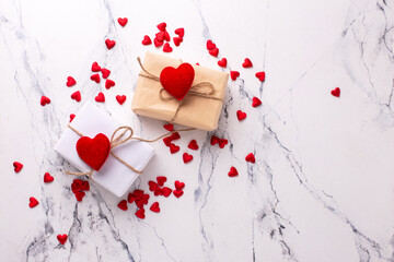 Romantic postcard.. Boxes with presents with hearts  on  white marble background.  Place for text. Top view. St. Valentines day, Mothers day postcard. - 554314213