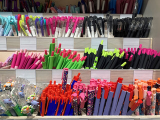 Abundance of pens on shop shelf display