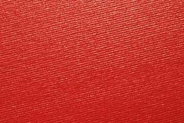 Red ribbed colored craft paper texture with golden glitter effect