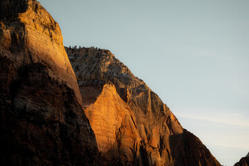 Incredible mountain view landscapes in the valley at Zion National Park in Utah United States. There are amazing colors of orange and yellows at all times of the day.
