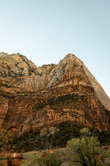 Incredible mountain view landscapes in the valley at Zion National Park in Utah United States. There are amazing colors of orange and yellows at all times of the day.