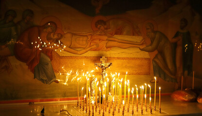 Funeral service, funeral liturgy in the Orthodox Church. Christians light candles in front of the...