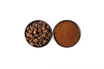 Bowl of ground coffee and coffee beans isolated on white background.