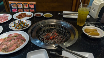 Yakiniku stove which has hot charcoal before grill meat. Empty barbecue grills with flaming charcoal.