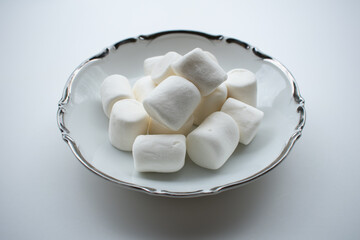 Pile of marshmallows in pretty bowl