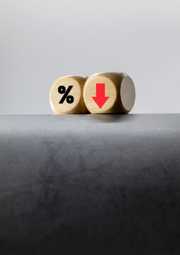 "Interest, Up, Down" wooden block with arrows, The concept of wanting interest rates to go down