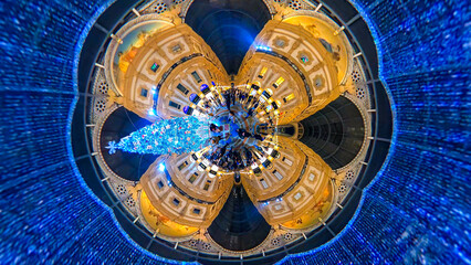 Albero di Natale. People take pictures at the SWAROVSKI Christmas tree in the luxury shops of the Victor Emanuele II Gallery. New Year holidays. Landscape. Piazza Duomo. Milan, Italy, December 2022