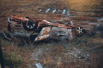 Overturned Shelled Car in the War in Ukraine