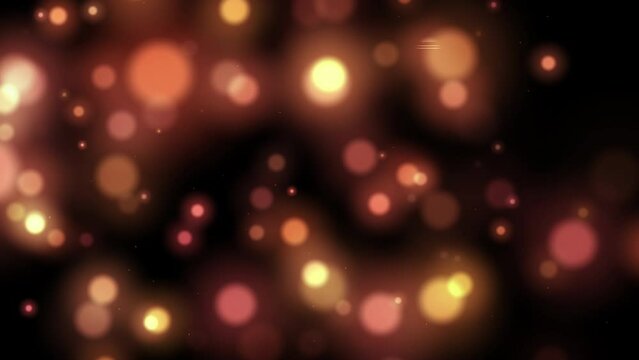 Gold and pink abstract bokeh background sparkling lights effect. Multicolor light from LED lights close up. Grain blurry noise, soft focus. Festive background for advertising, congratulations, text