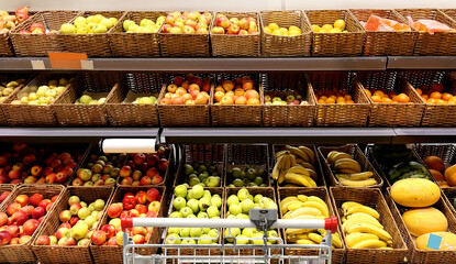 buying fruits(apples and pears)  at the market