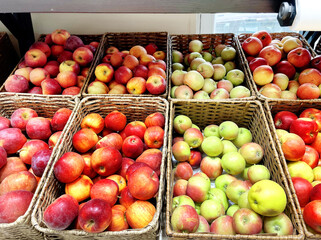 buying fruits(apples and pears)  at the market