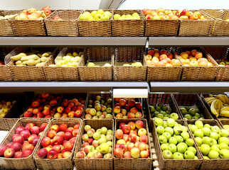 buying fruits(apples and pears)  at the market