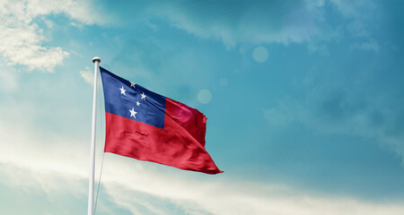 Waving Flag of Samoa in Blue Sky. The symbol of the state on wavy cotton fabric.