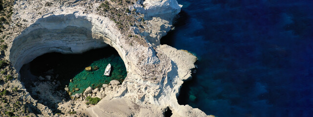 Aerial drone ultra wide panoramic photo with copy space of volcanic open cave in Mediterranean exotic destination island