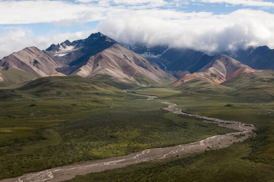 A river runs through the dramatic landscape in Denali National Park and Preserve.; Denali National Park and Preserve, Alaska