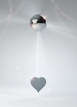 Valentine's Day silver heart invitation with sparkling disco dance mirror glitter ball with streamers, on white studio background. Bright, sophisticated and high-res image for print and screen.
