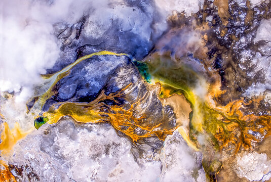 Clepsydra Geyser and colorful thermal runoff channels, Lower Geyser Basin, YNP, Wyoming, USA