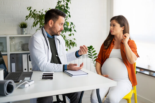 A Young pregnant woman having consultations with her obstetrician doctor at a private clinic