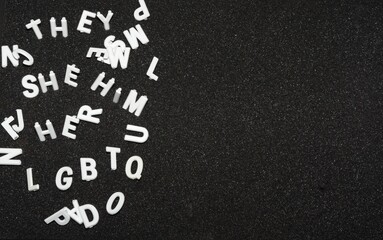 Pronouns He Her She Him They with LGBTQ Ltters on black foam