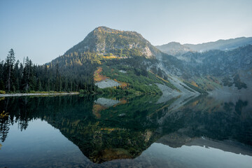 Rainy Lake with beautiful reflection on pond in high alpine region of northern washington state near north cascades national park.