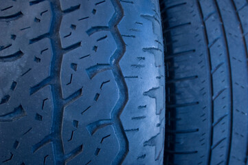 Close-up detail of worn treads on rubber vehicle tires; Lake Placid, Florida, United States of America