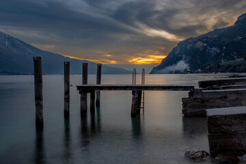 Deserted jetty on Lake Garda at sunset