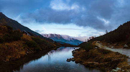 Fototapeta na wymiar Cloudscape at a water reservoir in the Tatra mountains