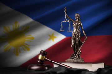 Philippines flag with statue of lady justice, constitution and judge hammer on black drapery....