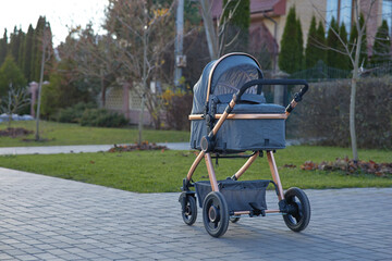 Baby stroller outdoor. Empty place for text. Front view.