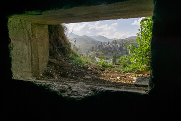 Town of Sallent de Gallego in the Pyrenees Mountains seen through a window of an old bunker, Alto Gallego, Huesca, Aragon, Spain