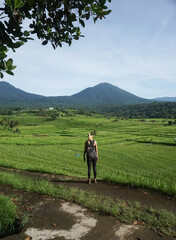 A woman walking around Tegalalang Rice field in Bali, Indonesia.