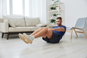 Man sportsman training at home, push-up exercises for arm, leg and back muscles, strong body and...