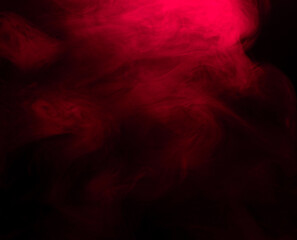 Abstract background of chaotically mixing puffs of red smoke on a dark background