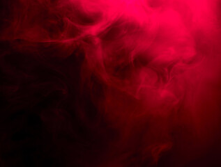 Fototapeta na wymiar Abstract background of chaotically mixing puffs of red smoke on a dark background
