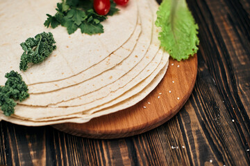 Armenian thin pita bread on a wooden Board.
