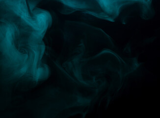 Abstract background of chaotically mixing clouds of turquoise smoke on a background of darkness