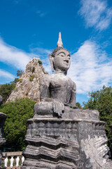 Fototapeta na wymiar black stone Buddha statue
