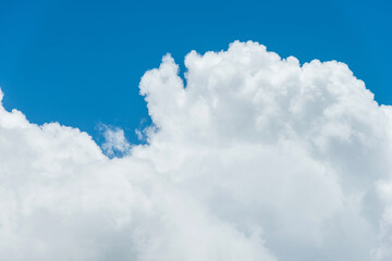 Naklejka na ściany i meble Large cloud on blue sky