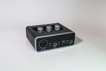 Audio interface. Electronic mini-component. portable. White background.